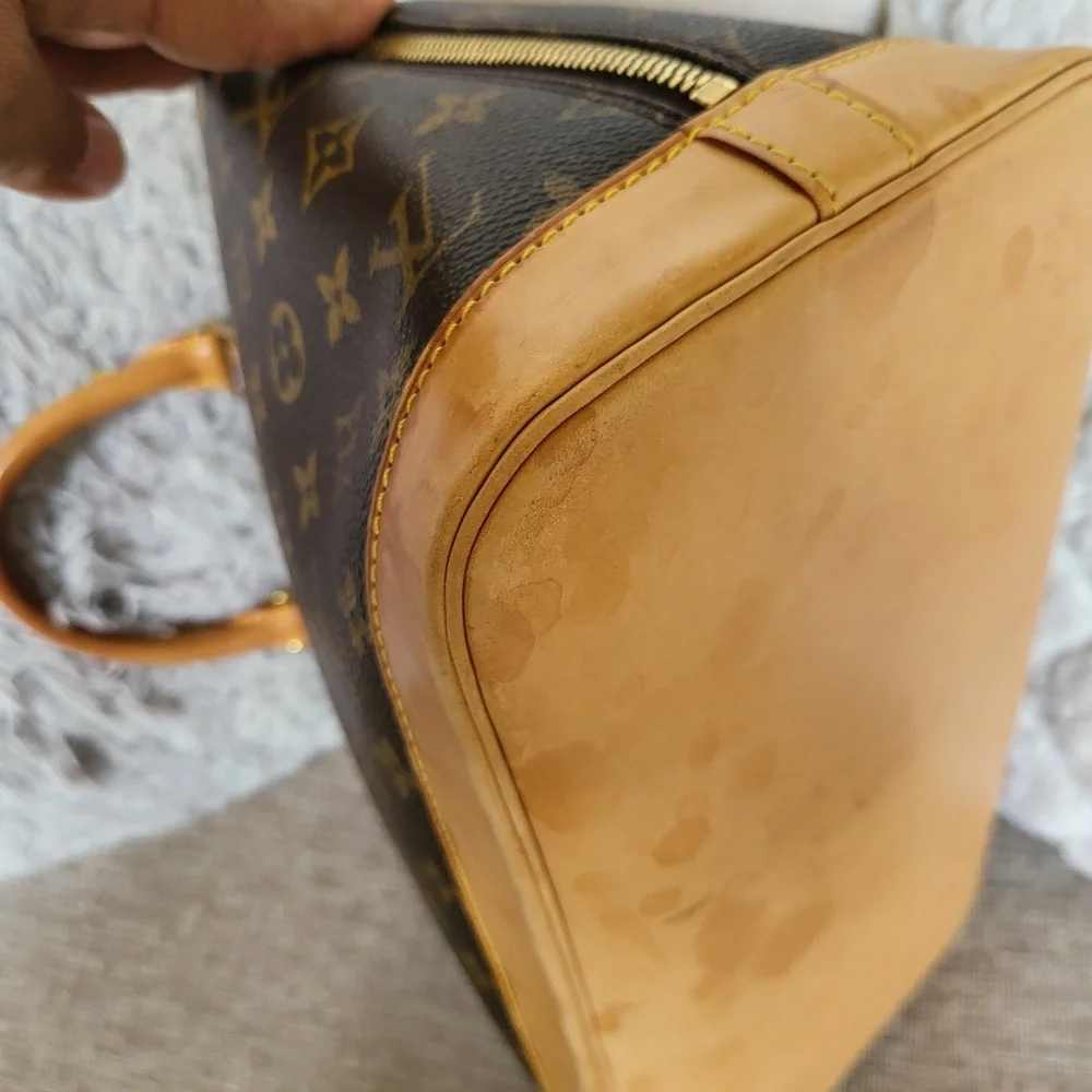 Authentic Louis Vuitton Monogram Alma PM Hand Bag..